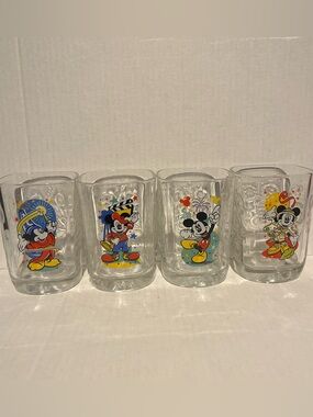 Vintage set of 4 McDonald's Walt Disney World Millennium Celebration glasses.